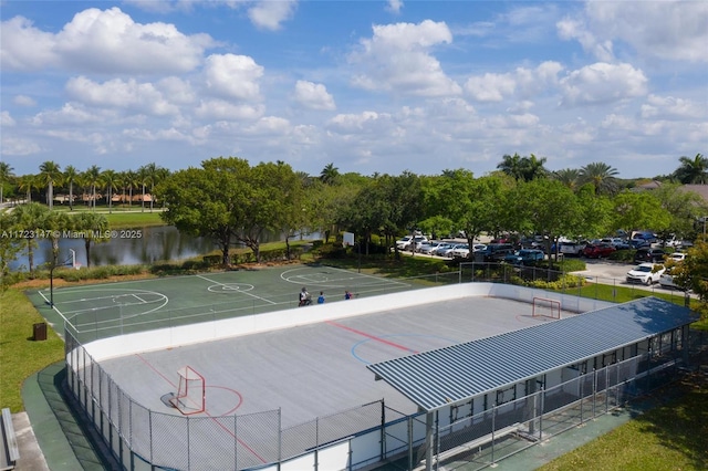 view of sport court featuring a water view