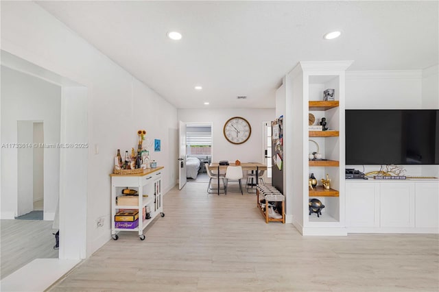 interior space with light wood-style floors and recessed lighting