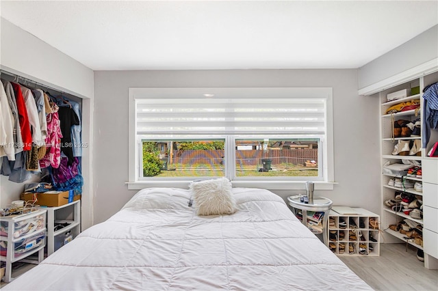 bedroom featuring a closet and wood finished floors