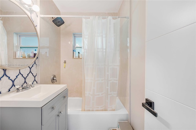 full bathroom featuring vanity and shower / bathtub combination with curtain