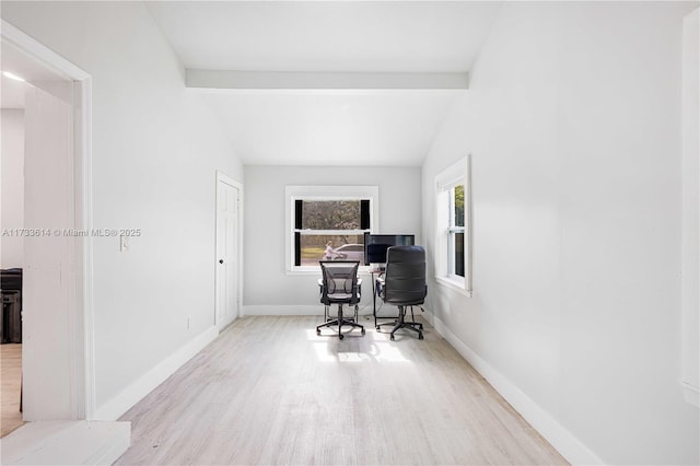 office area with lofted ceiling with beams, baseboards, and wood finished floors