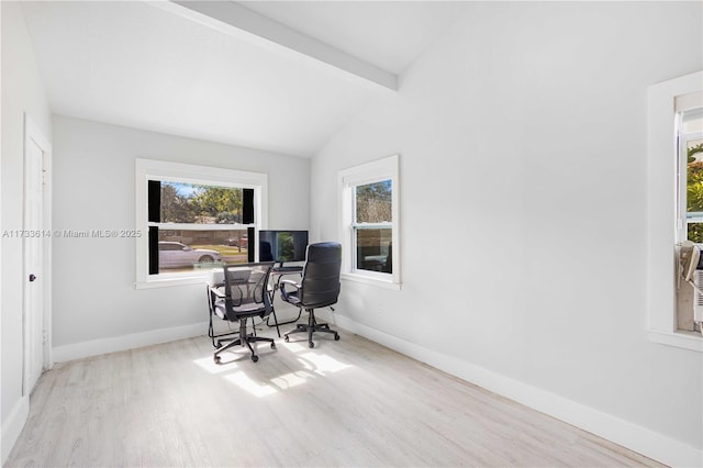 office area featuring lofted ceiling with beams, baseboards, and wood finished floors