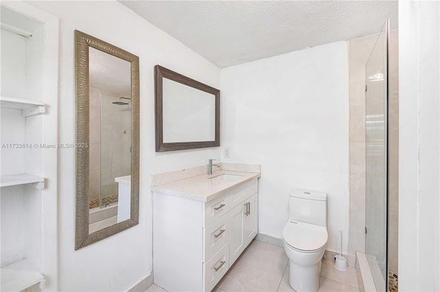 bathroom with toilet, a stall shower, a textured ceiling, vanity, and tile patterned flooring