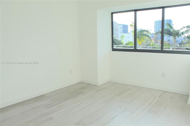 empty room with light hardwood / wood-style floors