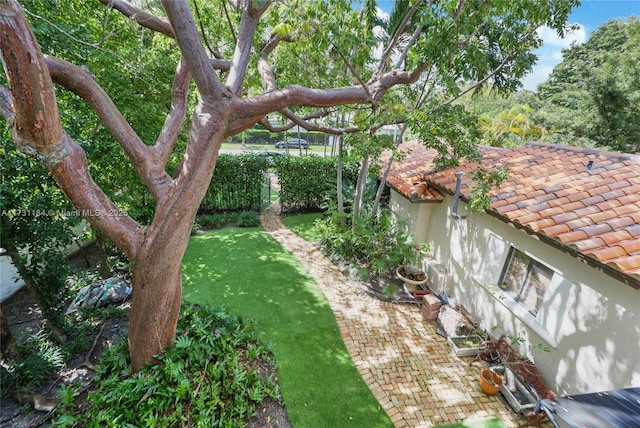 view of yard featuring fence and a patio