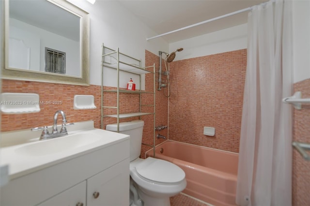 full bathroom featuring tasteful backsplash, vanity, shower / bathtub combination with curtain, and toilet