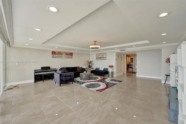 living room featuring visible vents, baseboards, a raised ceiling, crown molding, and recessed lighting