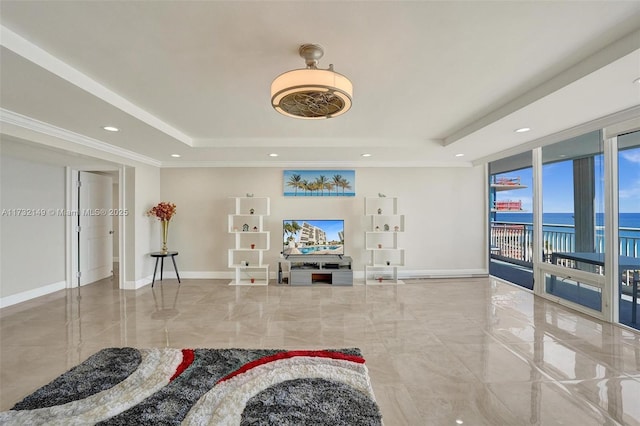 living area featuring recessed lighting, baseboards, marble finish floor, ornamental molding, and a tray ceiling