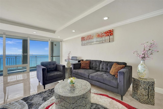 living area with light tile patterned floors, recessed lighting, a water view, baseboards, and ornamental molding