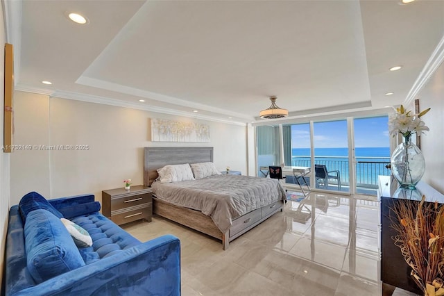 bedroom with access to outside, ornamental molding, a water view, and a raised ceiling