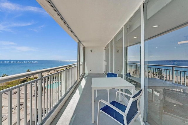 balcony featuring a water view