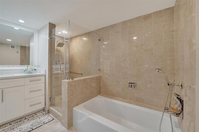 full bath with a stall shower, visible vents, a garden tub, vanity, and recessed lighting