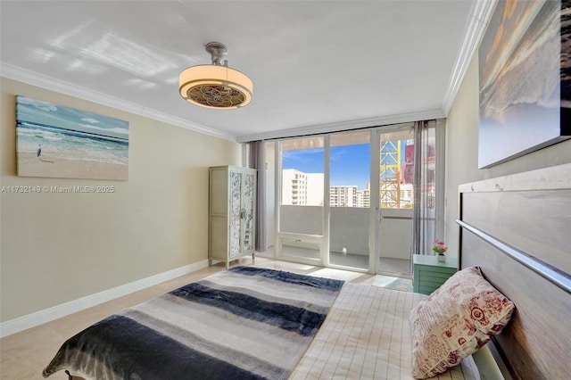 bedroom with access to exterior, a view of city, ornamental molding, expansive windows, and baseboards