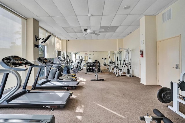 gym featuring visible vents and a drop ceiling