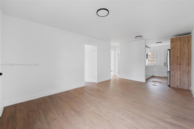 empty room with light wood-type flooring