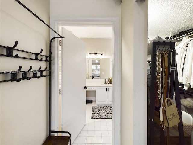 interior space with vanity and tile patterned flooring