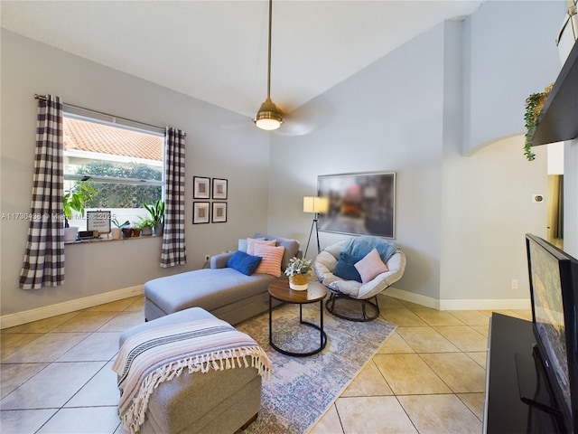 living room with light tile patterned floors and high vaulted ceiling