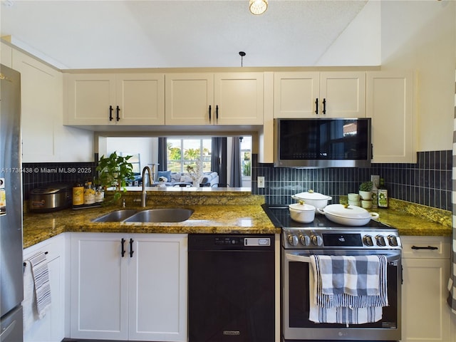 kitchen with tasteful backsplash, stainless steel appliances, sink, and dark stone counters