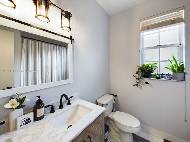 bathroom with vanity and toilet