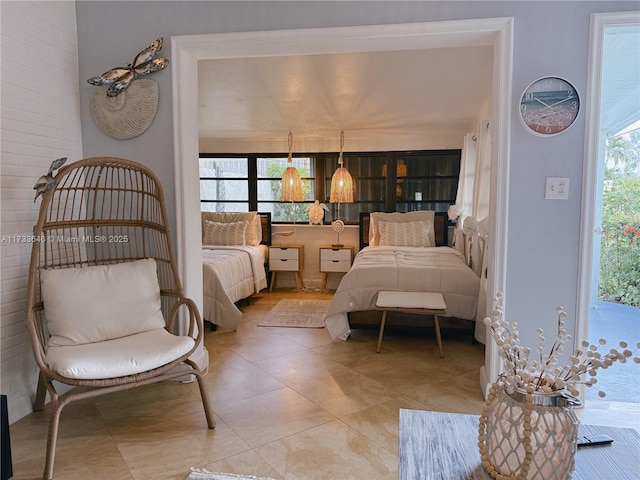 bedroom featuring light tile patterned flooring