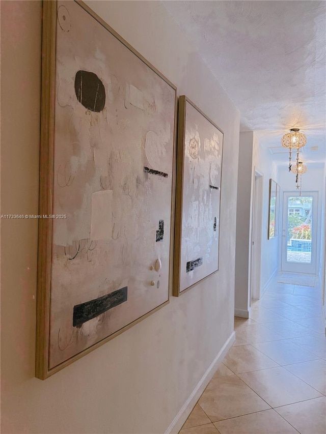 corridor featuring light tile patterned flooring