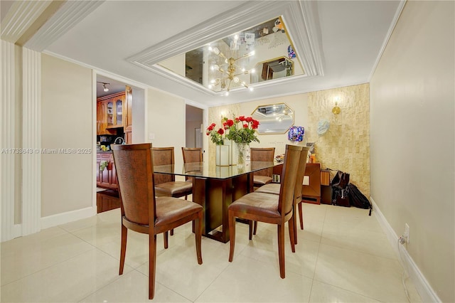 dining room featuring tile patterned floors and ornamental molding