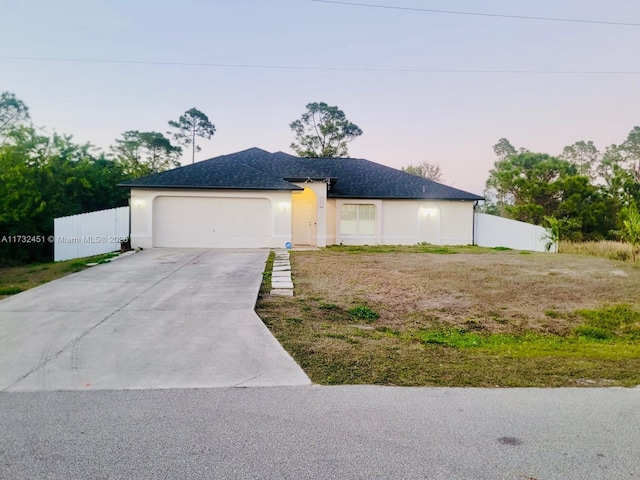 view of front of home with a garage