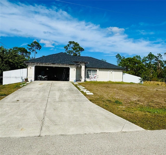 ranch-style house with a garage and a front yard