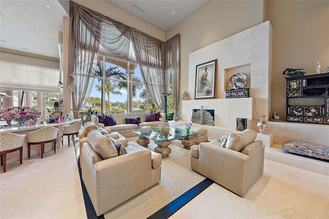 living room featuring a high ceiling