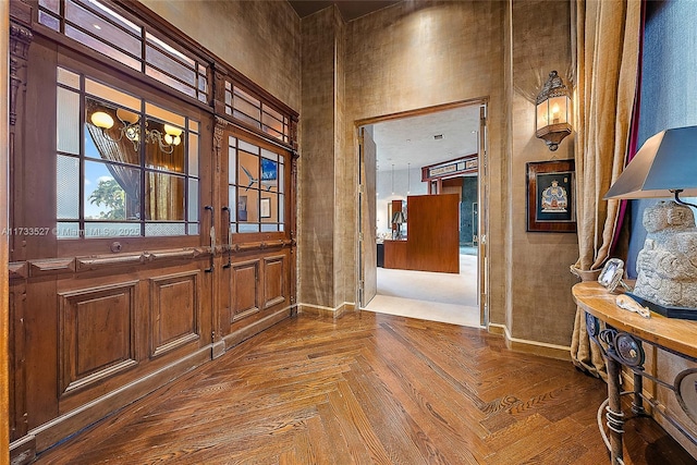 foyer featuring parquet flooring