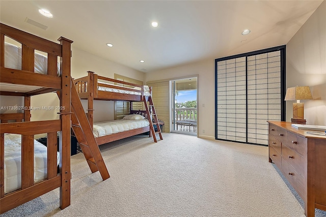 carpeted bedroom with access to outside