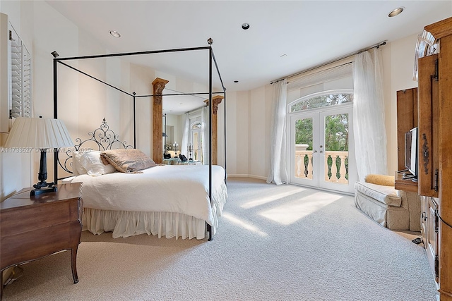 carpeted bedroom with access to outside and french doors