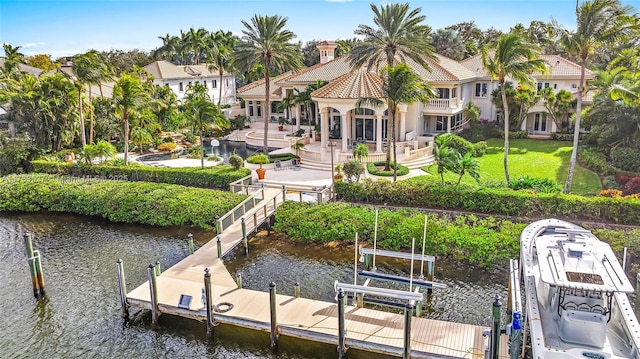 view of dock featuring a water view and a patio