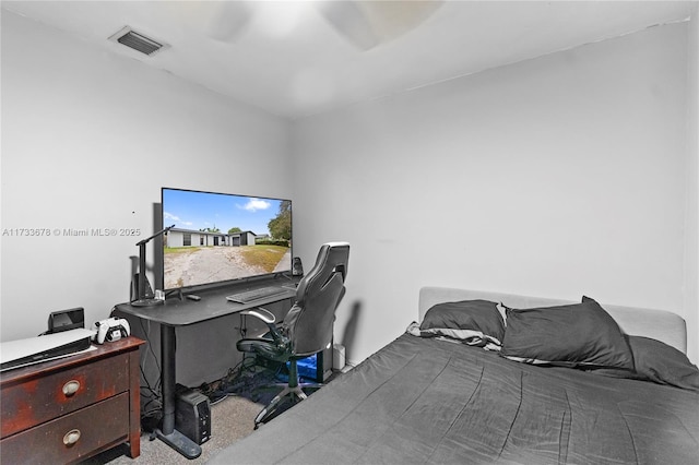 bedroom with light carpet and ceiling fan