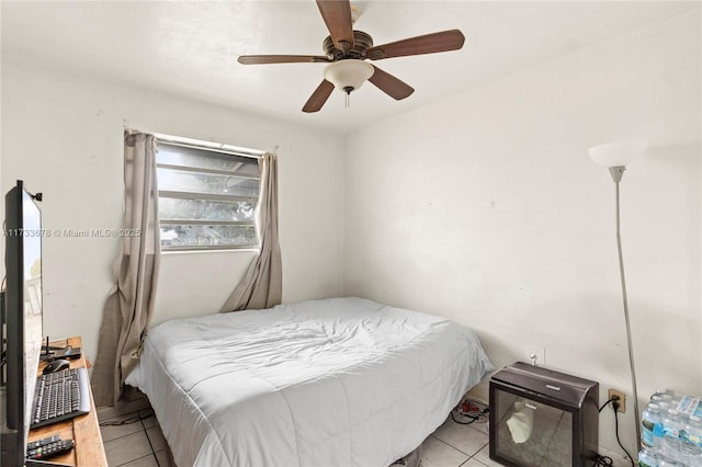 tiled bedroom with ceiling fan