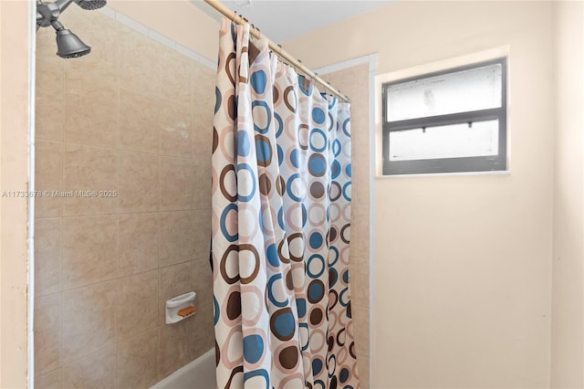 bathroom with shower / tub combo