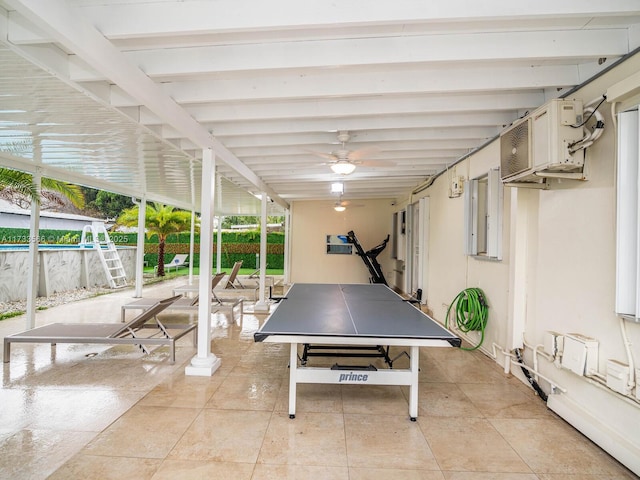 view of patio / terrace with a pool and ceiling fan