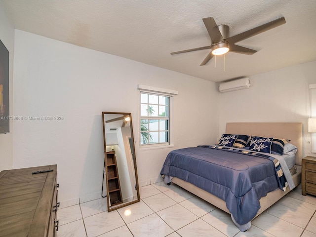 bedroom featuring a wall mounted air conditioner, a textured ceiling, and ceiling fan