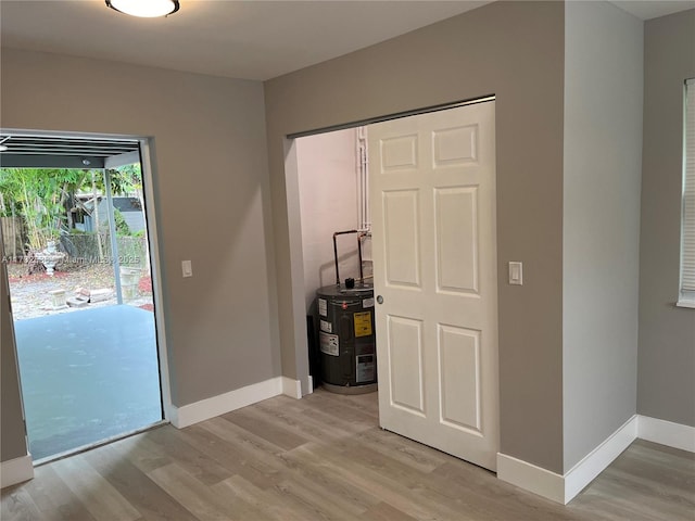 interior space featuring light hardwood / wood-style flooring and electric water heater