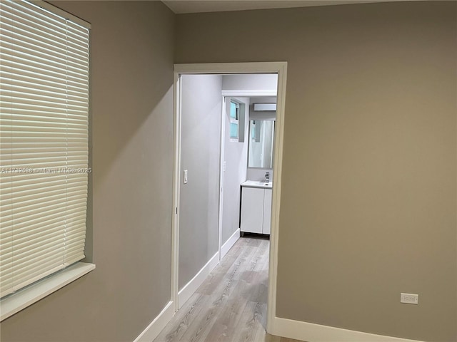 hallway featuring light hardwood / wood-style flooring