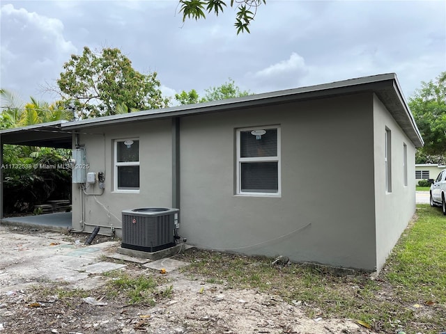 back of house with cooling unit