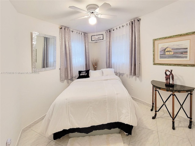 tiled bedroom with ceiling fan