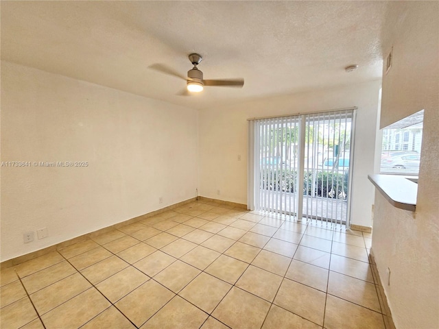 5740 Rock Island Rd Unit 274, Tamarac, FL 33319 - spare room with light tile patterned flooring, ceiling fan, and a textured ceiling