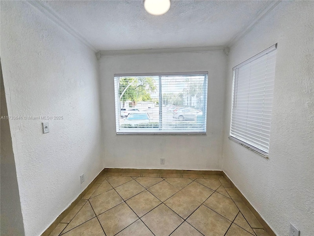 5740 Rock Island Rd Unit 274, Tamarac, FL 33319 - empty room featuring crown molding, a textured wall, and light tile patterned flooring