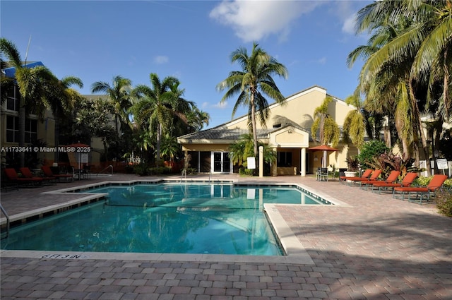 view of swimming pool with a patio area