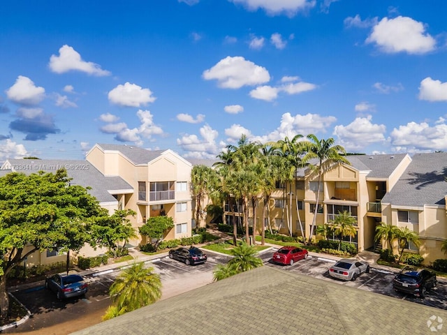 5740 Rock Island Rd Unit 274, Tamarac, FL 33319 - view of building exterior with a residential view and uncovered parking