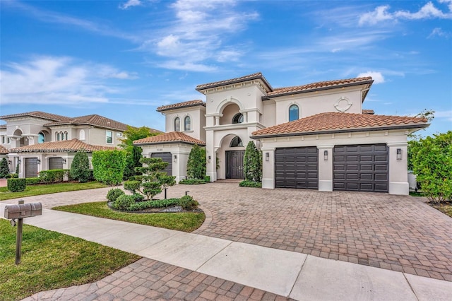 mediterranean / spanish house featuring a garage