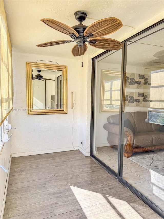 sunroom / solarium with ceiling fan