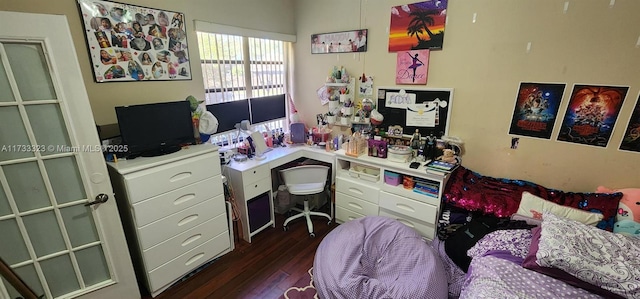 home office with dark hardwood / wood-style flooring