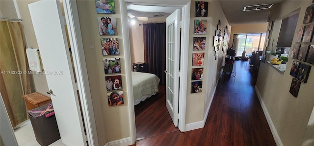 corridor with dark wood-type flooring